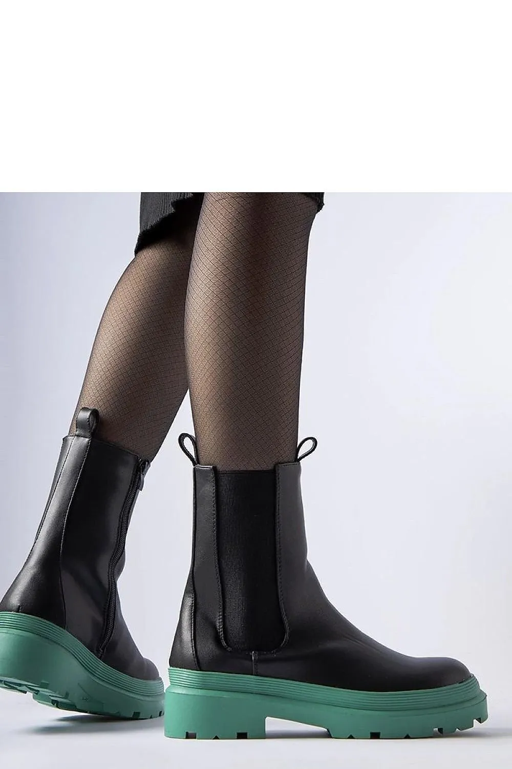 Black ankle boots with an olive sole