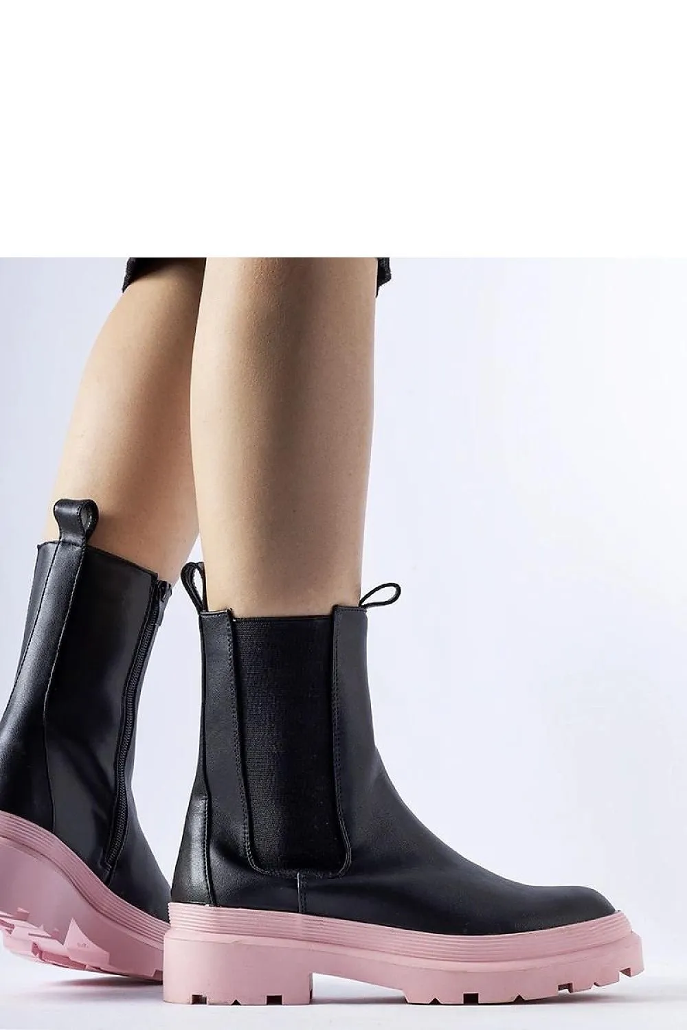 Black ankle boots with an olive sole